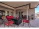 Covered patio with seating area and fire pit at 5736 E Lawndale St, Mesa, AZ 85215
