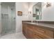 Bathroom with wood vanity and a walk-in shower at 7131 E Foothill Dr, Paradise Valley, AZ 85253