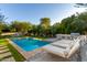 Inviting pool with lounge chairs and patio furniture at 7131 E Foothill Dr, Paradise Valley, AZ 85253