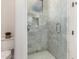 Modern shower with glass enclosure and marble-look tile at 7131 E Foothill Dr, Paradise Valley, AZ 85253