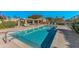 Inviting community pool and spa area with plenty of lounge chairs at 8428 W Utopia Rd, Peoria, AZ 85382