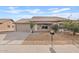 Single-story house with a two-car garage and desert landscaping at 8517 W Campbell Ave, Phoenix, AZ 85037