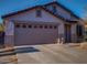 House exterior featuring a two-car garage and landscaping at 881 E Appaloosa Rd, Gilbert, AZ 85296