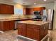 Modern kitchen with wood cabinets, granite countertops, and island at 881 E Appaloosa Rd, Gilbert, AZ 85296