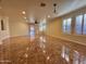 Spacious living room with tiled floors and access to backyard at 881 E Appaloosa Rd, Gilbert, AZ 85296