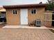 Tan storage shed with double windows at 881 E Appaloosa Rd, Gilbert, AZ 85296
