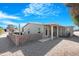 Single story home with gravel driveway and block wall at 9123 E Cactus S Ln, Sun Lakes, AZ 85248