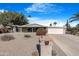 Ranch style home with landscaped yard and two car garage at 9123 E Cactus S Ln, Sun Lakes, AZ 85248