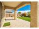 Covered patio overlooking a lush, green backyard with artificial turf at 9567 W Robin Ln, Peoria, AZ 85383