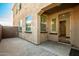 Spacious backyard patio with access to the home and a view of the grassy area at 9567 W Robin Ln, Peoria, AZ 85383