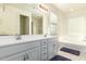 Bathroom with double vanity, bathtub, and separate shower at 9567 W Robin Ln, Peoria, AZ 85383