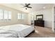 Bright bedroom with ensuite bathroom and plantation shutters at 9567 W Robin Ln, Peoria, AZ 85383