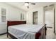 Bedroom with wood bed frame, ceiling fan, and walk-in closet at 9567 W Robin Ln, Peoria, AZ 85383