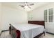 Bedroom with wood bed frame and ceiling fan at 9567 W Robin Ln, Peoria, AZ 85383