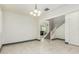 Dining room with white walls, gray baseboards, and white tile floor at 9567 W Robin Ln, Peoria, AZ 85383