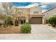 Two-story house with a large brown garage door and landscaping at 9567 W Robin Ln, Peoria, AZ 85383
