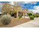 Two story house, light brown exterior, nicely landscaped front yard at 9567 W Robin Ln, Peoria, AZ 85383