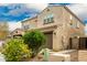 Two story house, light brown exterior, nicely landscaped front yard at 9567 W Robin Ln, Peoria, AZ 85383