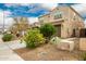 Two story house, light brown exterior, nicely landscaped front yard at 9567 W Robin Ln, Peoria, AZ 85383