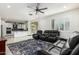 Gathering room with open concept kitchen and ceiling fan at 9567 W Robin Ln, Peoria, AZ 85383