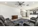 Gathering room with open concept kitchen and ceiling fan at 9567 W Robin Ln, Peoria, AZ 85383