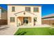 Two-story house with a covered patio and a well-manicured lawn at 9567 W Robin Ln, Peoria, AZ 85383