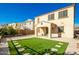 Two-story house with a covered patio and a well-manicured lawn at 9567 W Robin Ln, Peoria, AZ 85383