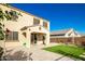 Two-story house with a covered patio and a well-manicured lawn at 9567 W Robin Ln, Peoria, AZ 85383