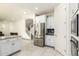 Modern kitchen with white cabinets, granite counters and stainless steel appliances at 9567 W Robin Ln, Peoria, AZ 85383