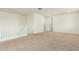 Open loft area with carpeted flooring and white walls at 9567 W Robin Ln, Peoria, AZ 85383