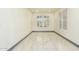 Bright office with white walls, gray baseboards and white tile floor at 9567 W Robin Ln, Peoria, AZ 85383