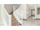 Modern staircase with white railings and carpeted steps at 9567 W Robin Ln, Peoria, AZ 85383