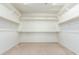 Large walk-in closet with ample shelving and hanging space at 9567 W Robin Ln, Peoria, AZ 85383