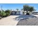 Front view of house showing driveway and landscaping at 10516 W Peoria Ave, Sun City, AZ 85351