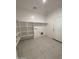 Laundry room with shelving and tile flooring at 10541 W Sonrisas St, Tolleson, AZ 85353