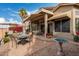 Brick paved patio with seating area, fire pit, and grill at 11542 W Pronghorn Ct, Surprise, AZ 85378