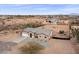 Aerial view of a house with a large backyard, including a playset and trampoline at 12121 S 214Th Ave, Buckeye, AZ 85326
