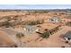 Aerial view of a house with a spacious backyard, playground, and trampoline at 12121 S 214Th Ave, Buckeye, AZ 85326