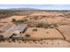 Aerial view showing a house and expansive desert lot at 12121 S 214Th Dr, Buckeye, AZ 85326