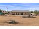 Backyard view showing a home with a playset and trampoline at 12121 S 214Th Dr, Buckeye, AZ 85326