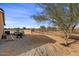 Landscaped backyard with a jet ski and plenty of space at 12121 S 214Th Ave, Buckeye, AZ 85326