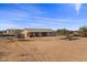Large backyard with trampoline and playset, offering lots of space at 12121 S 214Th Ave, Buckeye, AZ 85326