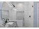 Modern bathroom with a walk-in shower and granite vanity at 12121 S 214Th Ave, Buckeye, AZ 85326