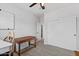Spacious bedroom with wood desk, large closet, and an adjacent bathroom at 12121 S 214Th Ave, Buckeye, AZ 85326