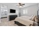 Spacious bedroom with large bed, dresser, and ensuite bathroom at 12121 S 214Th Ave, Buckeye, AZ 85326