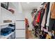 Large walk-in closet with shelving and hanging rods at 12121 S 214Th Ave, Buckeye, AZ 85326