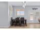 Bright dining area with wooden table and chairs near the back door at 12121 S 214Th Ave, Buckeye, AZ 85326