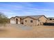 Single-story house with a two-car garage and desert landscaping at 12121 S 214Th Ave, Buckeye, AZ 85326