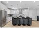 Spacious kitchen with granite island, stainless steel appliances, and white cabinets at 12121 S 214Th Ave, Buckeye, AZ 85326