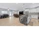Open concept kitchen boasts granite island, stainless steel appliances, and white cabinetry at 12121 S 214Th Ave, Buckeye, AZ 85326